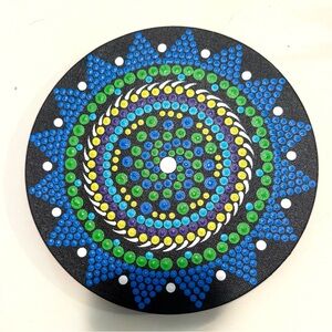 A hand-painted dot mandala art piece in vibrant Green and Blue, by Jennifer Boyd